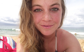 Girl with freckles on the beach