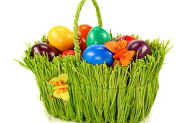 Green basket with eggs at Easter