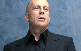 The famous actor Bruce Willis on a blue background
