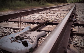 Electric guitar on the railroad