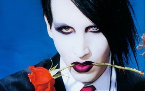 Marilyn Manson with a rose in his teeth