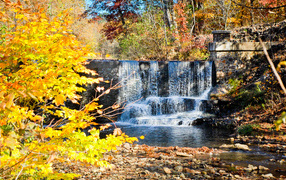 Artificial waterfall in autumn