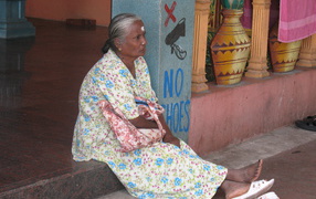 Indian resting on the doorstep