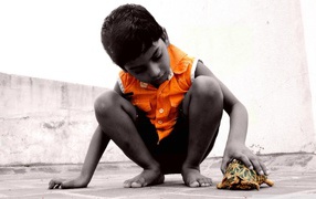 	   A child with a turtle