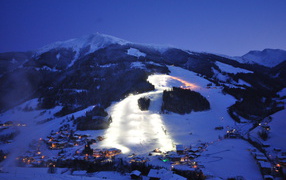 Night illumination of the ski slopes in the ski resort Saalbach-Hinterglemm, Austria