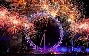 Ferris wheel on a background of fireworks in London