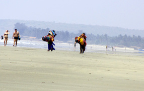 People on the beach in Ashwem