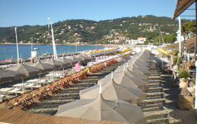 Autumn holiday on the beach in the resort Spotorno, Italy