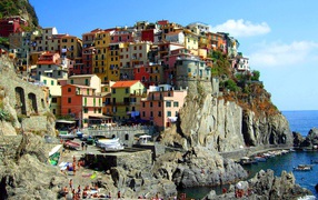 Houses on the cliff in the resort of Lido di Ezolo, Italy