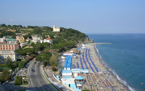 Relax on the beach in the resort of Celle Ligure, Italy