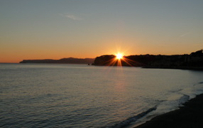 Sunset over the beach at the resort of Celle Ligure, Italy