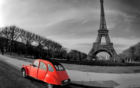 Red car on a background of the Eiffel Tower