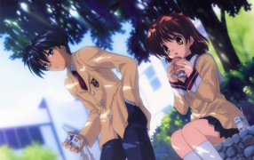 Man and woman under a tree in the anime Klannad