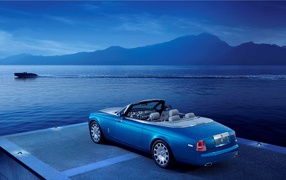 Blue convertible Rolls-Royce on the shore