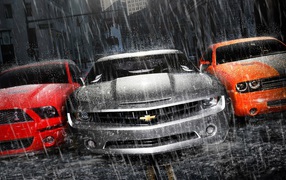 Powerful cars in the rain