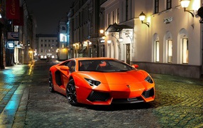 Orange Lamborghini evening on an empty street