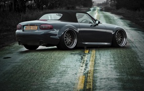 Car Mazda MX-5 stands across the highway