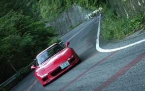 Red Mazda RX-7 on the racetrack
