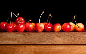 Ripe cherries on the board