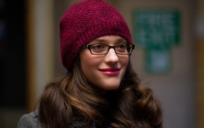 Girl with glasses and a red cap
