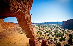 Fearless climber climbing a cliff