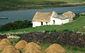Thatched house on the river bank