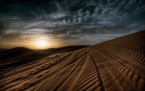 Tire tracks in the sand in the desert