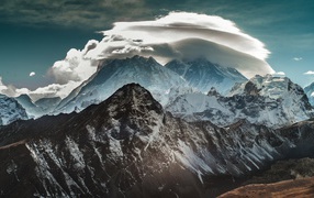 Round cloud on the mountain peaks in the Himalayas