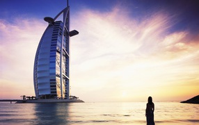 The girl at the sea shore looking at Burj Dubai