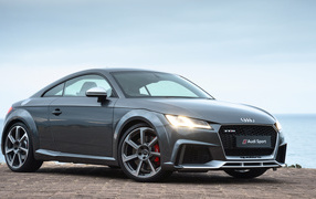 Silver sports car Audi TT RS, 2018 with headlights on