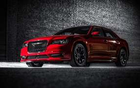 Red car Chrysler 300S, 2017 on a brick wall background