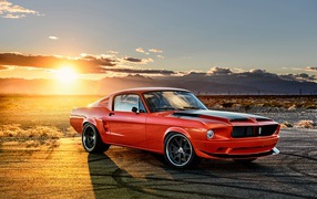 Red car Ford Mustang at sunset