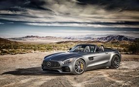 Silver Mercedes-AMG GT car on the sky background