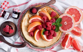Pancakes with grapefruit and raspberries Pancake