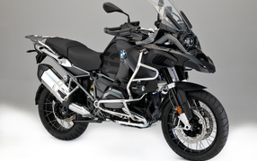 Black motorcycle BMW R1200GS on a gray background