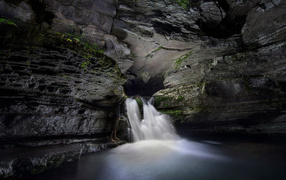 Fast waterfall in a stone cave
