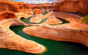 Picturesque Glen Canyon with green water Lake Powell, Utah, USA