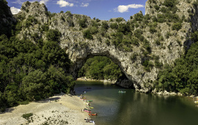 Rocky arch over the river in France