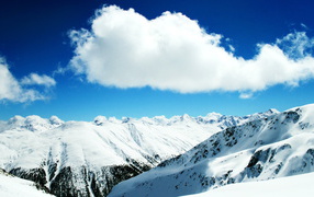 Beautiful clouds over the snow-capped mountains