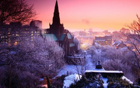 Pink winter sunset over a city