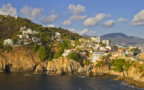 Houses on a cliff near the coast, the city of Acapulco Mexico