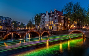 Bridge and night buildings in Amsterdam, Netherlands