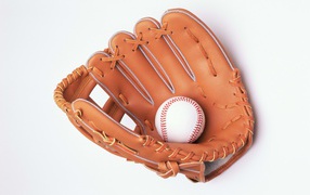A glove and a baseball on a white background 