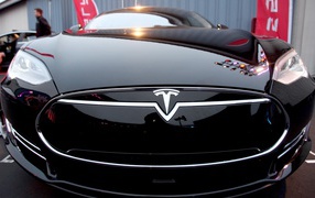 Stylish black car Tesla Model 3 front view
