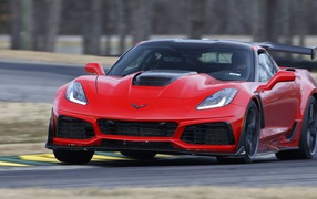 Red fast car Corvette ZR1, 2019 on the track