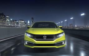 Yellow car Honda Civic, 2019 on the background of the city
