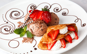 Pancake with strawberries, cream and ice cream balls at Shrovetide