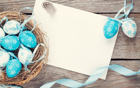 Blue easter eggs with ribbons, greeting card template