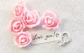 Pink artificial roses with hearts