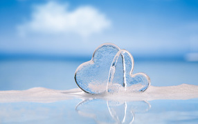Two icy hearts on a blue background